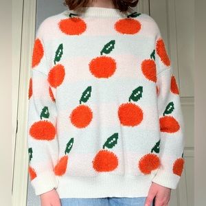 cider sweater with orange pattern